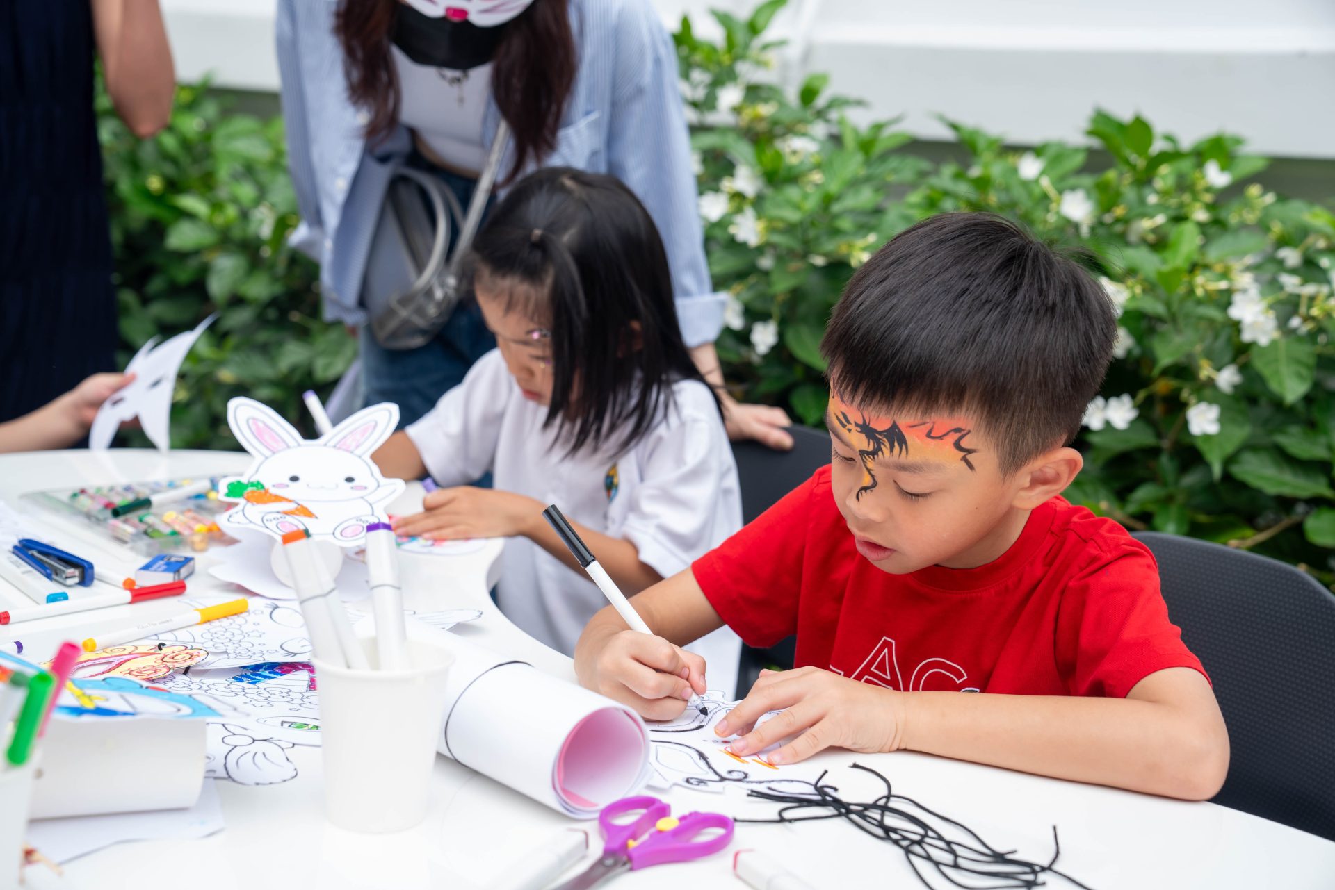 Kids drawing, making their own lantern at NLCS Moon Festival